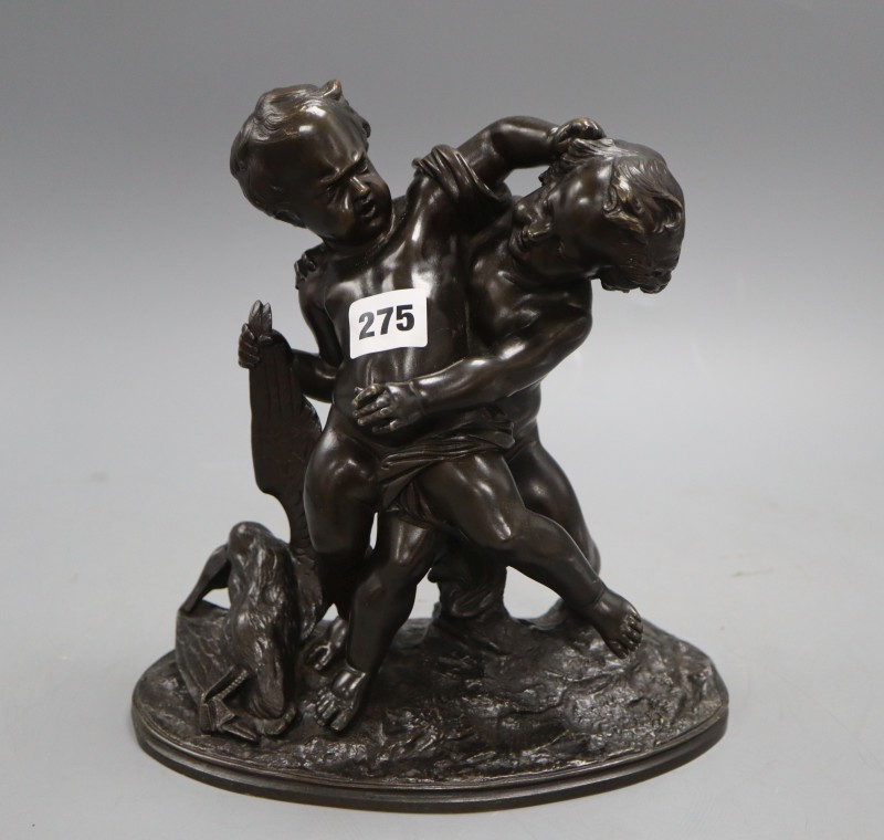 A bronze group of two fighting cherubs, height 23cm